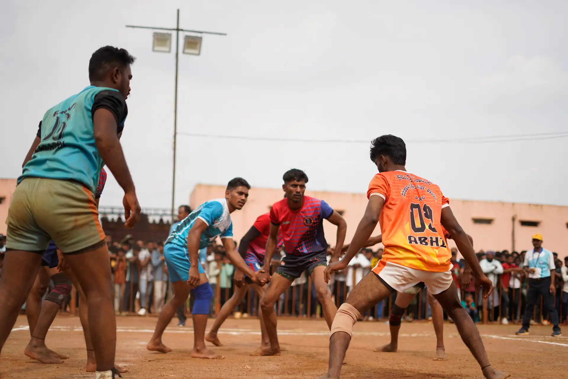 A kabaddi match in progress before a packed crowd during Kittur Utsava