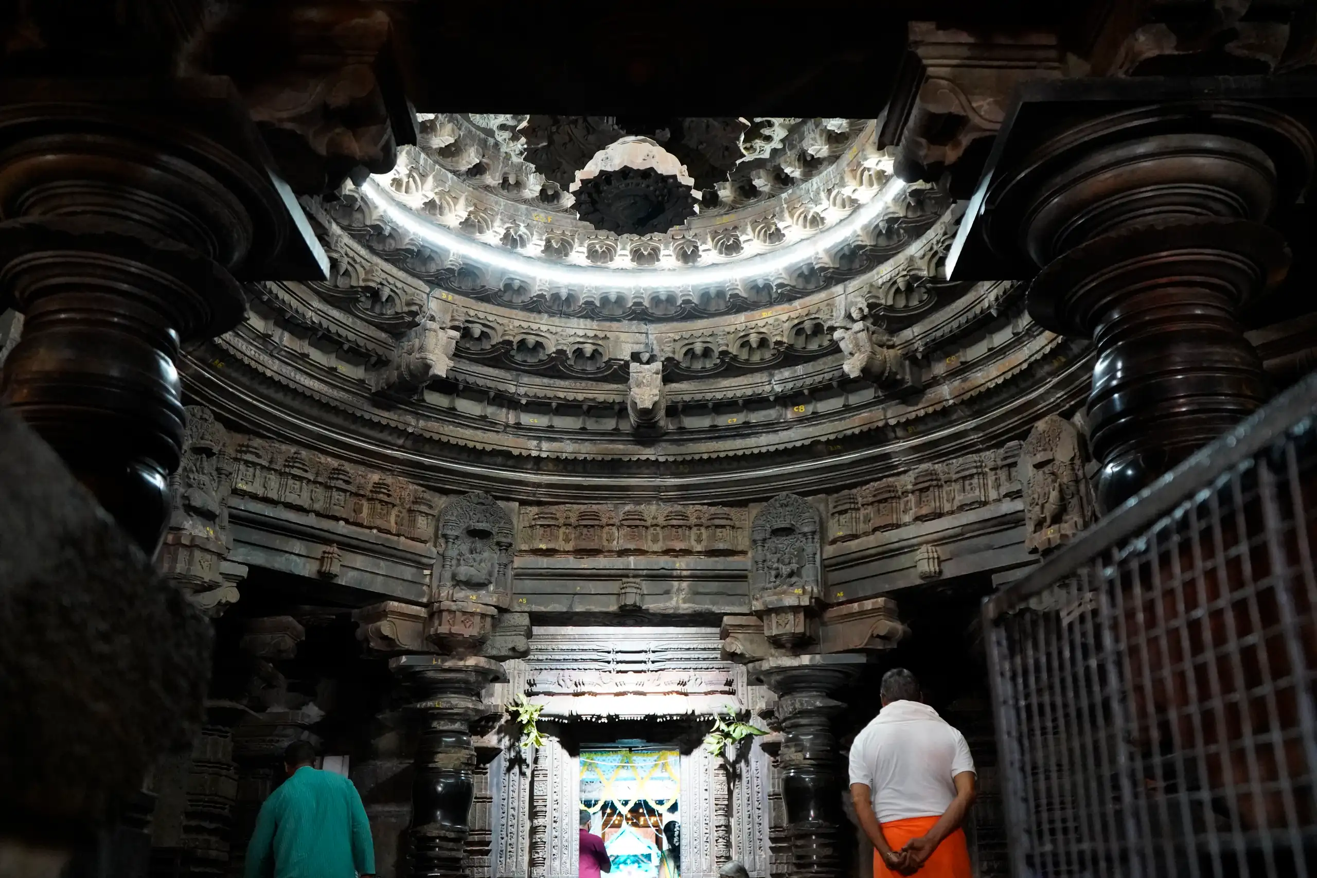 The carved lotus ceiling and polished black pillars inside Kamal Basti, Belagavi Fort